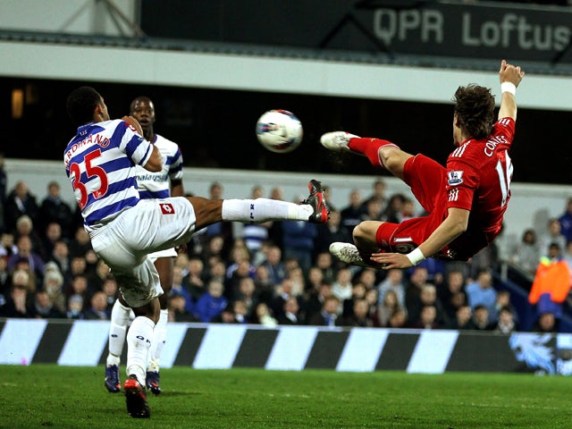 Sebastian Coaytes of Liverpool scores the first goal during the Barclays Premier League match between Queens Park Rangers and Liverpool at Loftus Road on March 21, 2012