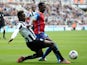Mapou Yanga-Mbiwa (L) of Newcastle United tackles Yannick Bolasie of Crystal Palace (R) during the Barclays Premier League match on March 22, 2014