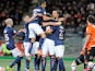 Paris Saint-Germain's Italian midfielder Thiago Motta is congratulated by his teammates after scoring during the French L1 football match Lorient (FCL) against Paris Saint-Germain (PSG) on March 21, 2014 