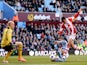 Peter Odemwingie of Stoke shoots past goalkeeper Brad Guzan of Aston Villa to score a goal during the Barclays Premier League match on March 23, 2014