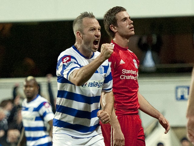 Queens Park Rangers' English midfielder Shaun Derry celebrates scoring his goal during the English Premier League football match between Queens Park Rangers and Liverpool at Loftus Road in London, England on March 21, 2012