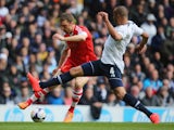 Rickie Lambert of Southampton tries to get past Tottenham Hotspur's Younes Kaboul during their Premier League match on March 23, 2014