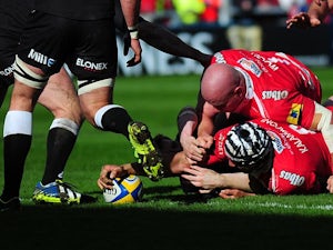Gloucester's Sione Kalamafoni stretches over to score his team's first try against Newcastle Falcons during the Aviva Premiership match on March 22, 2014