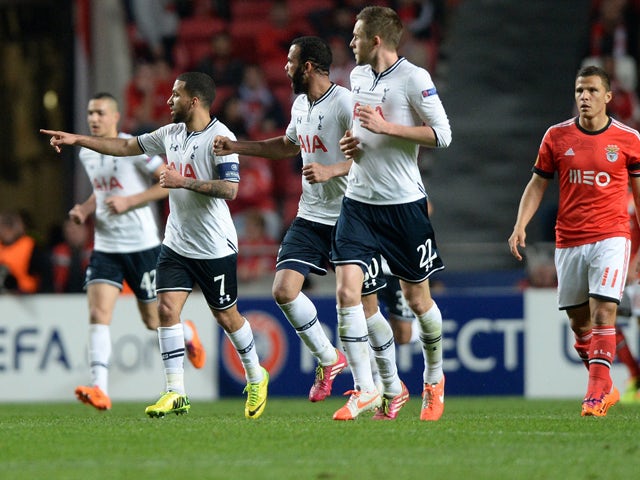Tottenham midfielder Aaron Lennon and teammates celebrate their goal during the UEFA Europa League Round of 16 football match SL Benfica vs Tottenham Hotspur FC at the Luz stadium in Lisbon on March 20, 2014