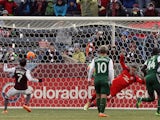 Vicente Sanchez #7 of Colorado Rapids scores on a penalty kick against goalkeeper Andrew Weber in the 73rd minute at Dick's Sporting Goods Park on March 22, 2014