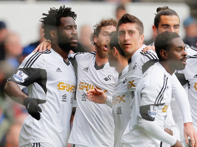 Wilfried Bony of Swansea City celebrates his goal with team mates during the Barclays Premier League match against Everton on March 22, 2014
