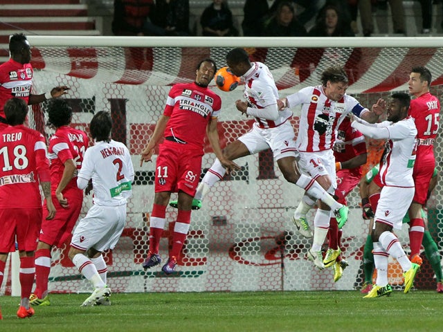 Ajaccio's French and Senegalese midfielder Ricardo Faty scores a header during the French L1 football match Ajaccio (ACA) vs Toulouse (TFC) on March 29, 2014
