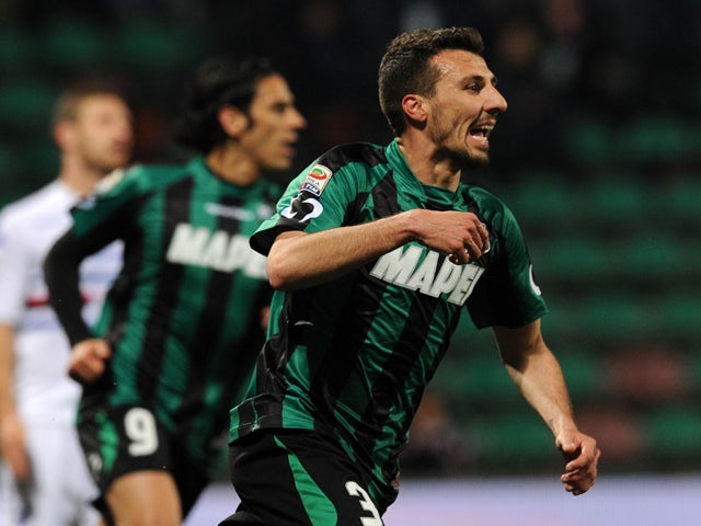 Alessandro Longhi of Sassuolo celebrates after scoring the goal 1-1 during the Serie A match between US Sassuolo Calcio and UC Sampdoria at Mapei Stadium on March 26, 2014