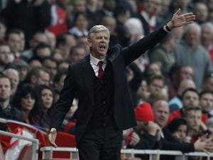 Arsenal's French Manager Arsene Wenger gestures from the touchline during the English Premier League football match between Arsenal and Manchester City at the Emirates Stadium in London on March 29, 2014