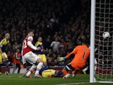 Arsenal's French striker Olivier Giroud shoots to score their second goal past Swansea City's Dutch goalkeeper Michel Vorm during the English Premier League football match between Arsenal and Swansea City at the Emirates Stadium in London on March 25, 201