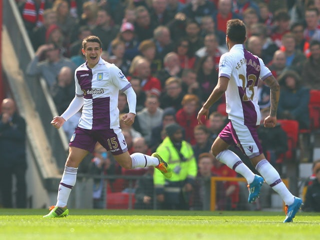 Ashley Westwood of Aston Villa celebrates scoring the first goal from a free-kick during the Barclays Premier League match between Manchester United and Aston Villa at Old Trafford on March 29, 2014