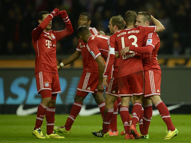 Bayern Munich's French midfielder Franck Ribery celebrates scoring with his teammates during the German first division Bundesliga football match Hertha BSC Berlin vs FC Bayern Munich in Berlin's Olympic Stadium on March 25, 2014