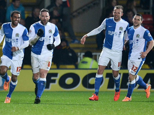 David Dunn of Blackburn Rovers celebrates scoring the 2nd goal with team-mates during the Sky Bet Championship match between Watford and Blackburn Rovers at Vicarage Road on March 25, 2014