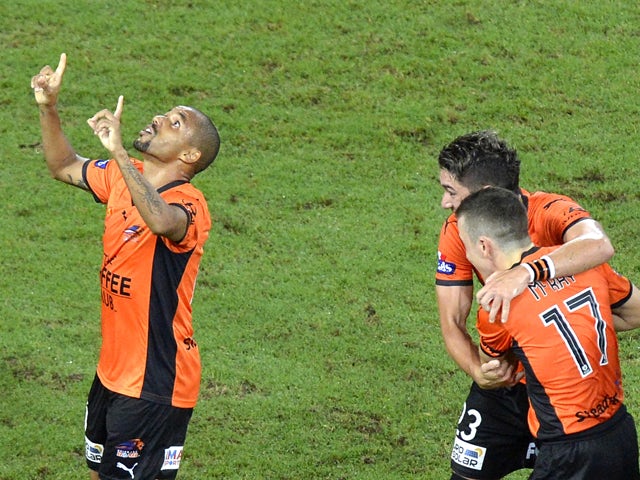 Henrique of the Roar celebrates after scoring a goal during the round 25 A-League match between Brisbane Roar and Melbourne Heart at Suncorp Stadium on March 28, 2014