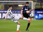 Andrea Ranocchia of FC Inter Milan and Bruno Fernandes of Udinese Calcio (L) compete for the ball during the Serie A match on March 27, 2014