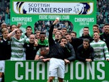 The Celtic squad celebrate winning the 2013-2014 Championship after the Scottish Premier League match between Celtic and Ross County at Celtic Park Stadium on March 29, 2014