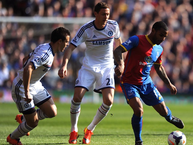 Jason Puncheon of Crystal Palace is closed down by Cesar Azpilicueta and Nemanja Matic of Chelsea during the Barclays Premier League match between Crystal Palace and Chelsea at Selhurst Park on March 29, 2014 