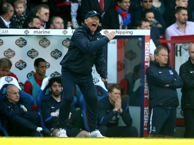 Tony Pulis the Crystal Palace manager shouts directions to his players during the Barclays Premier League match between Crystal Palace and Chelsea at Selhurst Park on March 29, 2014