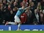 Manchester City's Bosnian forward Edin Dzeko celebrates after scoring the opening goal during the English Premier League football match between Manchester United and Manchester City at Old Trafford in Manchester on March 25, 2014