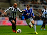 Yoan Gouffran of Newcastle United and Gerard Deulofeu of Everton battle for the ball during the Barclays Premier League match between Newcastle United and Everton at St James' Park on March 25, 2014