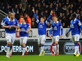 Ross Barkley of Everton celebrates scoring the pening goal with team mates during the Barclays Premier League match between Newcastle United and Everton at St James' Park on March 25, 2014