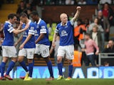 Steven Naismith of Everton celebrates scoring his team's third goal with team mates during the Barclays Premier League match between Fulham and Everton at Craven Cottage on March 30, 2014