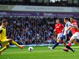 Graham Dorrans of West Brom scores the second goal past David Marshall of Cardiff City during the Barclays Premier League match on March 29, 2014