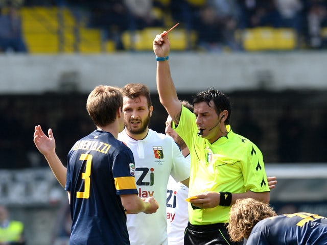 Referee Domenico Celi shows red card to Michelangelo Albertazzi #3 of Hellas Verona during the Serie A match between Hellas Verona FC and Genoa CFC at Stadio Marc'Antonio Bentegodi on March 30, 2014