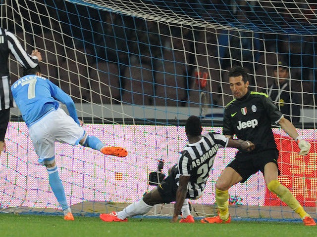 Josè Maria Callejon of Napoli scores the opening goal during the Serie A match between SSC Napoli and Juventus at Stadio San Paolo on March 30, 2014