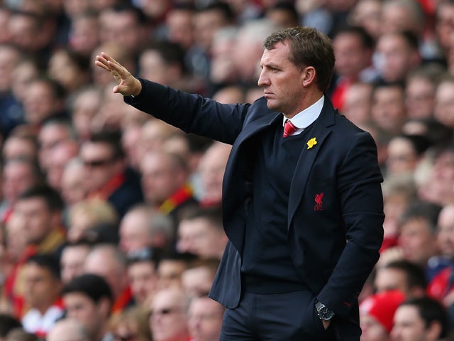 Liverpool Manager Brendan Rodgers gestures during the Barclays Premier League match between Liverpool and Tottenham Hotspur at Anfield on March 30, 2014