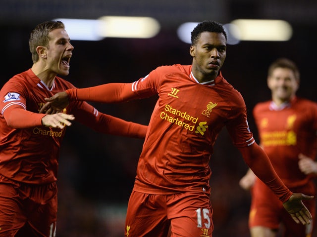 Daniel Sturridge of Liverpool celebrates scoring the second goal with team-mate Jordan Henderson during the Barclays Premier League match between Liverpool and Sunderland at Anfield on March 26, 2014