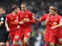 Jordan Henderson of Liverpool celebrates with his team-mates after scoring the fourth goal during the Barclays Premier League match between Liverpool and Tottenham Hotspur at Anfield on March 30, 2014