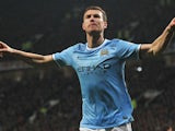 Manchester City's Bosnian forward Edin Dzeko celebrates after scoring the second goal during the English Premier League football match between Manchester United and Manchester City at Old Trafford in Manchester on March 25, 2014