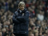 Manchester City's Chilean manager Manuel Pellegrini watches from the touchline during the English Premier League football match between Arsenal and Manchester City at the Emirates Stadium in London on March 29, 2014