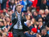 Manchester United Manager David Moyes applauds the fans at the end of the Barclays Premier League match between Manchester United and Aston Villa at Old Trafford on March 29, 2014