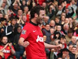 Juan Mata of Manchester United celebrates scoring his team's third goal during the Barclays Premier League match between Manchester United and Aston Villa at Old Trafford on March 29, 2014
