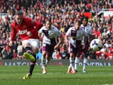 Wayne Rooney of Manchester United scores his team's second goal from a penalty kick during the Barclays Premier League match between Manchester United and Aston Villa at Old Trafford on March 29, 2014