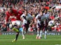 Wayne Rooney of Manchester United scores his team's second goal from a penalty kick during the Barclays Premier League match between Manchester United and Aston Villa at Old Trafford on March 29, 2014