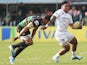 Manu Tuilagi of Leicester breaks away from Northampton's Luther Burrell during the Aviva Premiership match on March 29, 2014