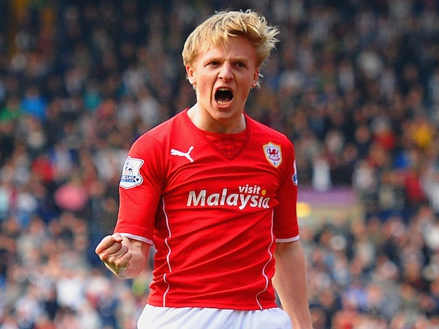 Mats Moller Daehli of Cardiff City celebrates scoring their third goal during the Barclays Premier League match between West Brom on March 29, 2014