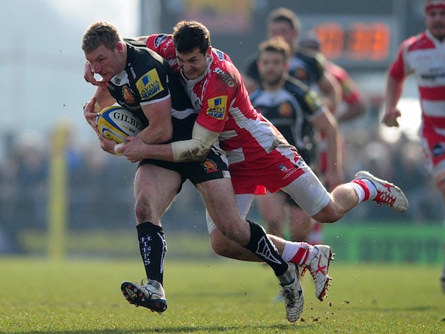 Matt Jess of Exeter Chiefs is tackled by Jonny May of Gloucester during the Aviva Premiership match between Exeter Chiefs and Gloucester at Sandy Park on March 29, 2014