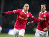PSV Eindhoven player Memphis Depay celebrates scoring an equalizing goal with teammate Adam Maher during the Dutch Eredivisie soccer match between PSV Eindhoven and Vitesse Arnhem in Eindhoven, The Netherlands, on December 7, 2013