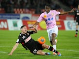 Evian's Ivory Coast's midfielder Eric Tie Bi (R) vies with Monaco's Colombian midfielder James Rodriguez during their French L1 football match Evian (ETGFC) vs Monaco (ASMFC) march 29, 2014