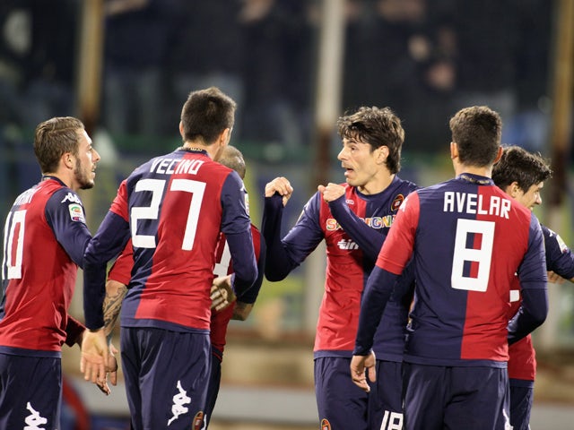 Nene of Cagliari celebrates with team-mates after scoring 1-0 during the Serie A match between Cagliari Calcio and Hellas Verona FC at Stadio Sant'Elia on March 26, 2014