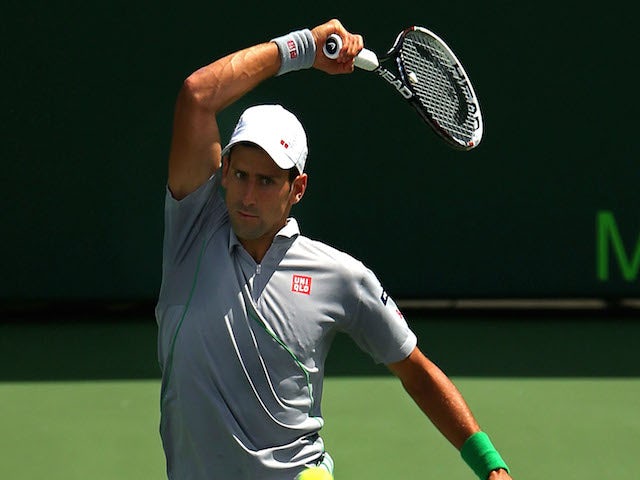 Novak Djokovic of Serbia returns a shot to Rafael Nadal of Spainduring the Final of the Sony Open at Crandon Park Tennis Center on March 30, 2014