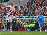 Peter Odemwingie of Stoke City scores during the Barclays Premier League match between Stoke City and Hull City at Britannia Stadium on March 29, 2014