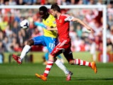 Mapou Yanga-Mbiwa of Newcastle passes ahead of Jay Rodriguez of Southampton during the Barclays Premier League match between Southampton and Newcastle United at St Mary's Stadium on March 29, 2014 