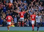 Steven Caulker of Cardiff City celebrates infront of the Cardiff City fans after scoring their second goal during the Barclays Premier League match on March 29, 2014