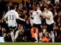 Louis Saha of Spurs is congratulated by teammates Ryan Nelsen and Gareth Bale after scoring his team's third goal during the FA Cup sixth round match between Tottenham Hotspur and Bolton Wanderers at White Hart Lane on March 27, 2012