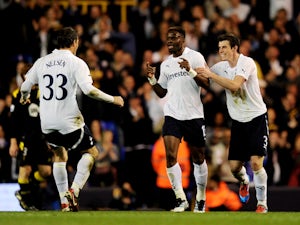 Louis Saha of Spurs is congratulated by teammates Ryan Nelsen and Gareth Bale after scoring his team's third goal during the FA Cup sixth round match between Tottenham Hotspur and Bolton Wanderers at White Hart Lane on March 27, 2012